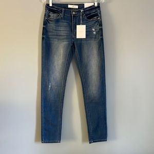 Comfortable skinny Jeans. Navy blue, with faded thighs. Small holes